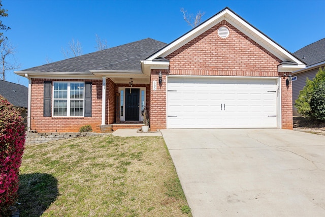 single story home featuring brick siding, driveway, a front yard, and a garage