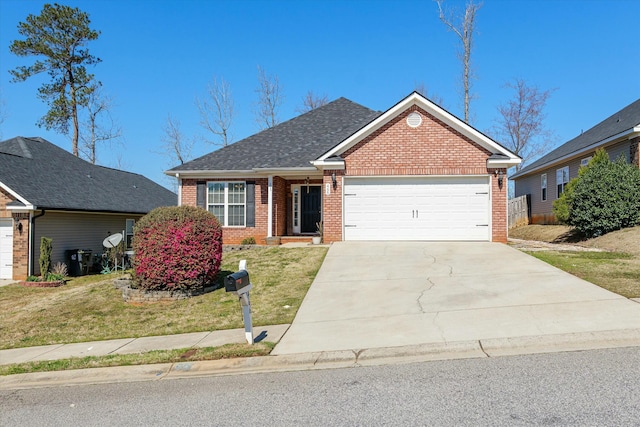 view of front facade featuring brick siding, a shingled roof, concrete driveway, a front yard, and an attached garage