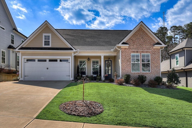 view of front facade with a garage, a front yard, brick siding, and driveway