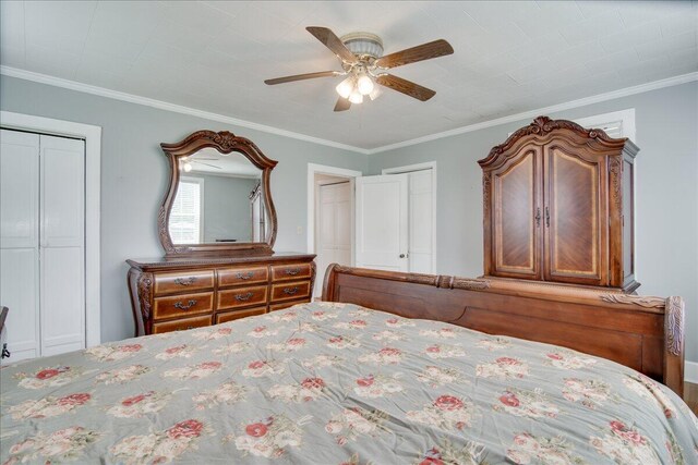 unfurnished bedroom featuring ceiling fan, crown molding, and two closets