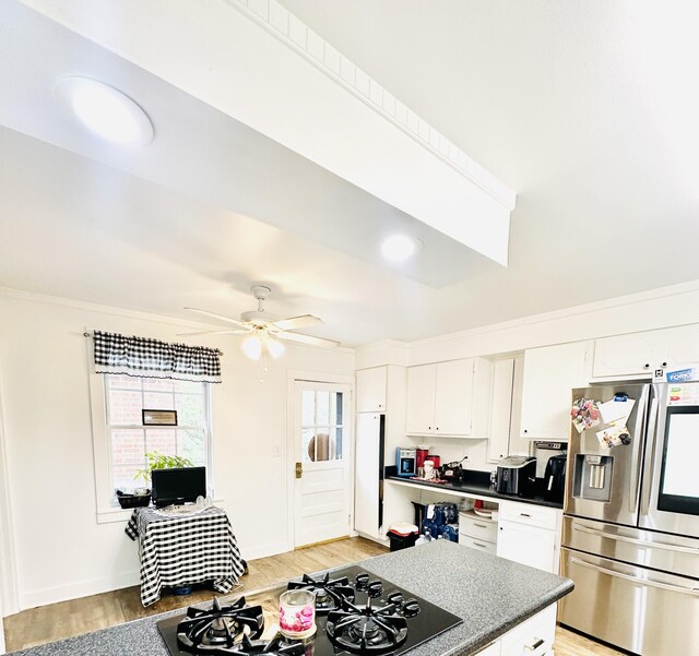 kitchen featuring white cabinets, stainless steel fridge with ice dispenser, black gas cooktop, and light hardwood / wood-style flooring