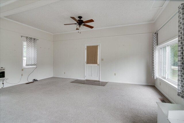 carpeted empty room with a textured ceiling and ceiling fan