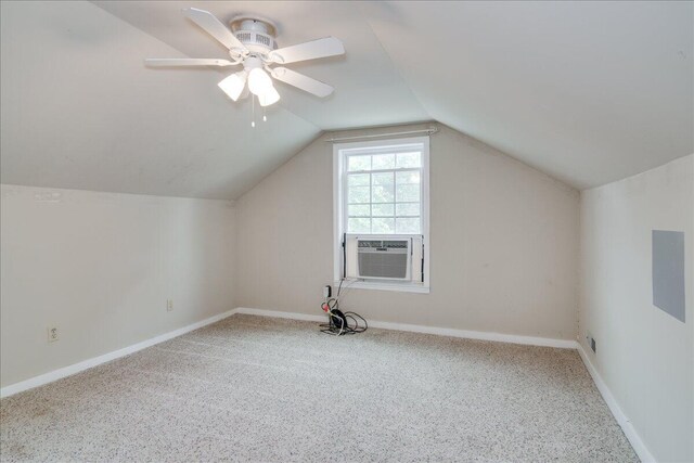 additional living space featuring cooling unit, ceiling fan, carpet floors, and vaulted ceiling