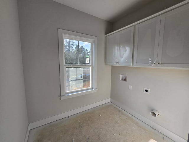 clothes washing area featuring hookup for an electric dryer, cabinets, and hookup for a washing machine