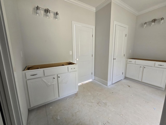 bathroom featuring ornamental molding and concrete floors