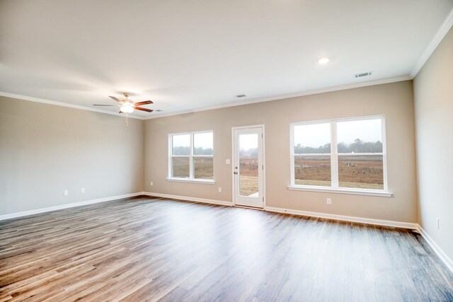 empty room with crown molding, light hardwood / wood-style flooring, and ceiling fan