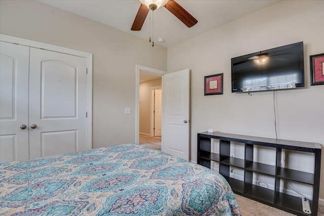 carpeted bedroom featuring a closet, ceiling fan, and baseboards