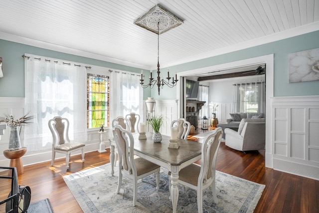 dining room featuring dark hardwood / wood-style flooring, wooden ceiling, and an inviting chandelier