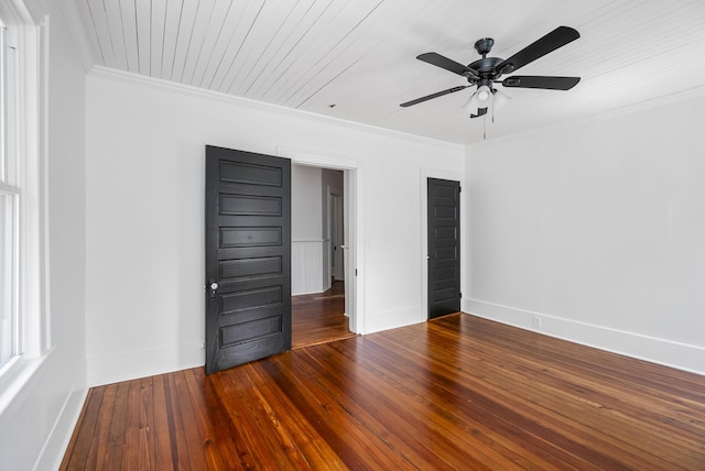 interior space featuring wood ceiling, crown molding, ceiling fan, and wood-type flooring