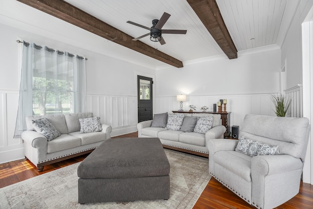 living room with dark hardwood / wood-style flooring, ceiling fan, crown molding, beam ceiling, and wooden ceiling