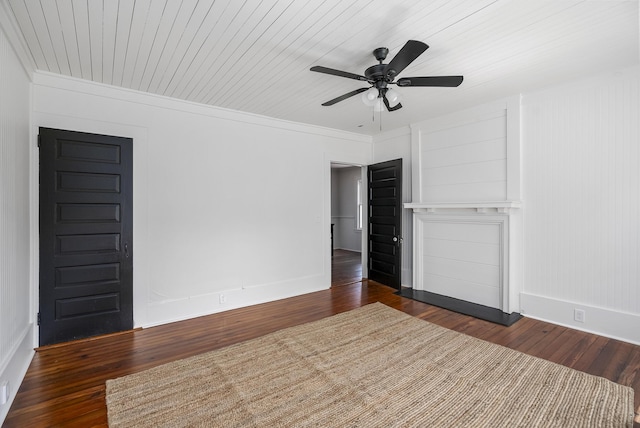 unfurnished living room with dark hardwood / wood-style floors, ceiling fan, and ornamental molding