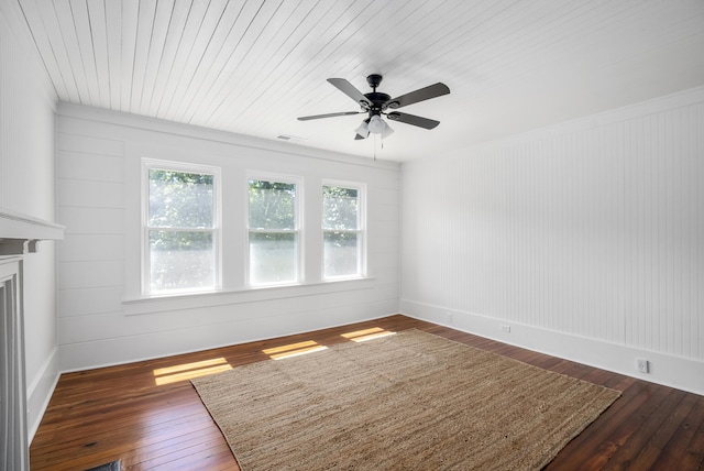 empty room featuring ceiling fan and dark hardwood / wood-style floors