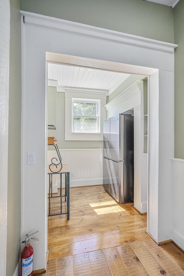 hall with light hardwood / wood-style flooring