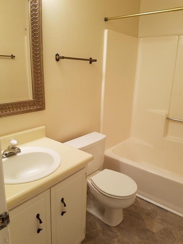 full bathroom featuring bathtub / shower combination, toilet, and vanity