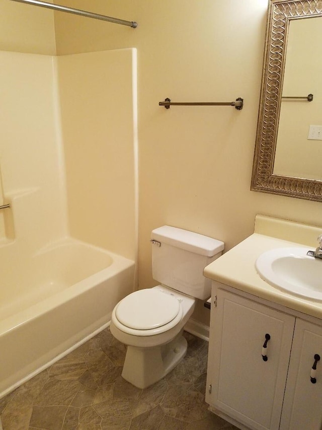 full bathroom featuring shower / bathing tub combination, toilet, and vanity