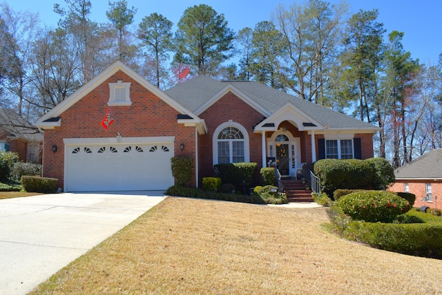 view of front of house featuring brick siding, driveway, an attached garage, and a front yard