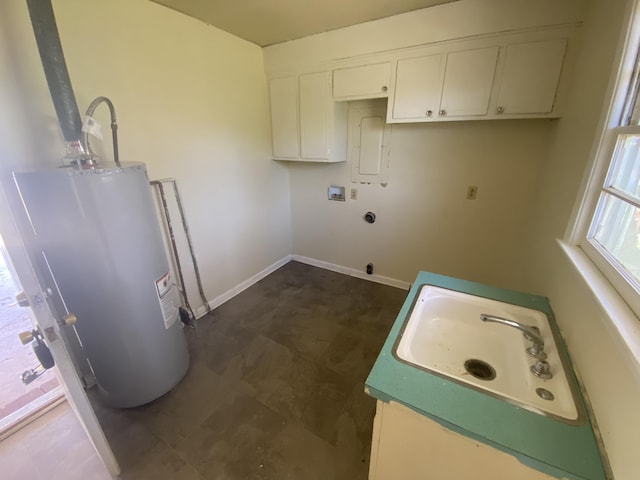 clothes washing area featuring gas water heater, hookup for a washing machine, hookup for an electric dryer, laundry area, and a sink