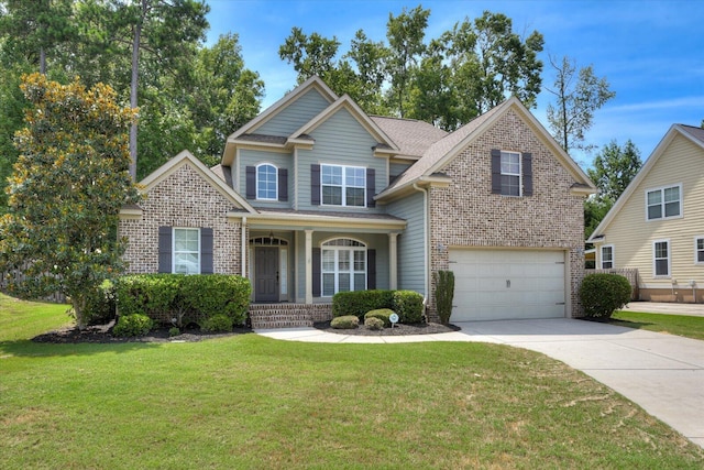 view of front of house featuring a front yard and a garage