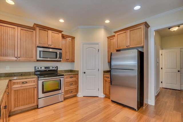 kitchen with appliances with stainless steel finishes, stone countertops, light hardwood / wood-style flooring, and ornamental molding