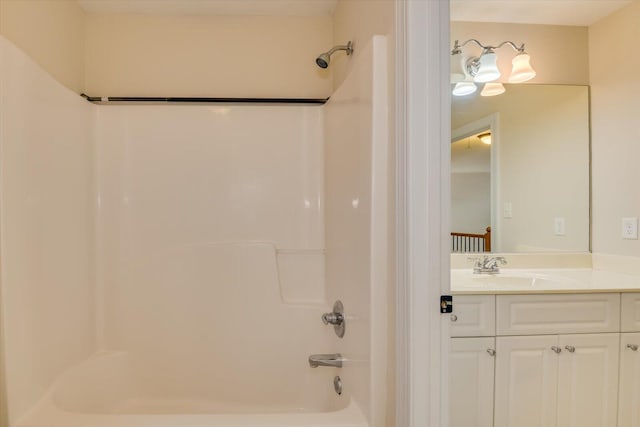 bathroom featuring vanity and  shower combination