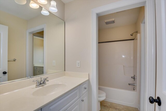 full bathroom with shower / bathing tub combination, vanity, toilet, and tile patterned floors