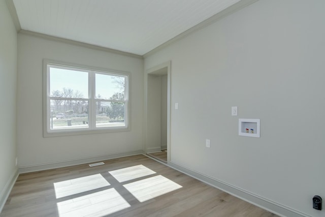 unfurnished room featuring crown molding and light hardwood / wood-style flooring