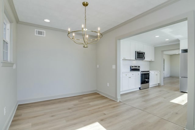 2319 Woodbine Rd, Augusta, GA 30904 - unfurnished dining area featuring ornamental molding, a chandelier, light wood-type flooring, and recessed lighting