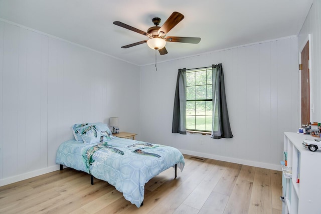 307 Terrace Hill Rd, Wrens, GA 30833 - bedroom featuring light wood-type flooring, baseboards, ceiling fan, and ornamental molding