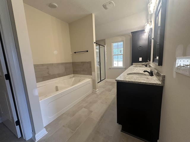 bathroom featuring tile patterned flooring, vanity, and separate shower and tub