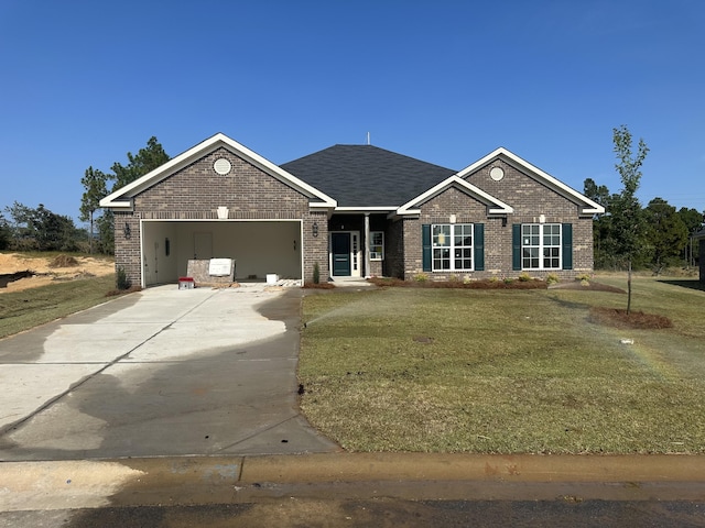 view of front of home with a garage and a front yard