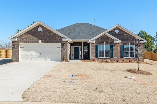 view of front of property featuring a garage and a front yard