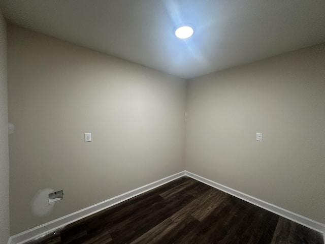 empty room featuring dark hardwood / wood-style flooring