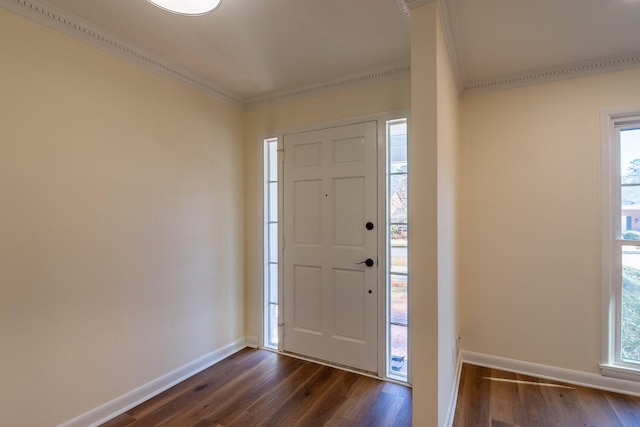 entryway with ornamental molding, dark wood finished floors, and baseboards