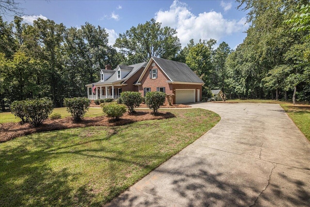 view of front facade with a porch, a garage, and a front lawn