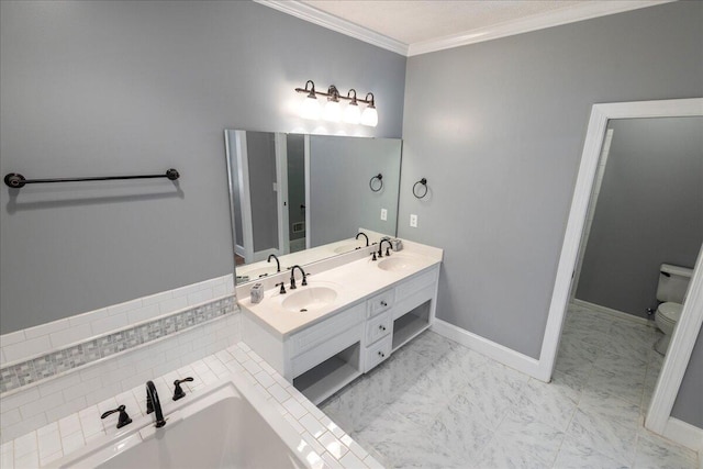 bathroom featuring a bath, vanity, toilet, and crown molding