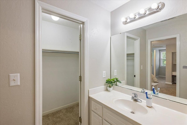 bathroom featuring vanity and a textured ceiling