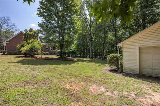 view of yard with a garage