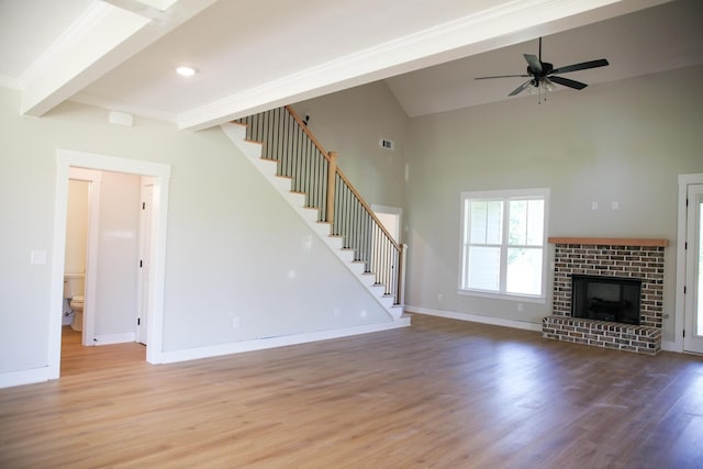 3540 Mistletoe Rd, Appling, GA 30802 - unfurnished living room with a ceiling fan, baseboards, wood finished floors, beamed ceiling, and stairway