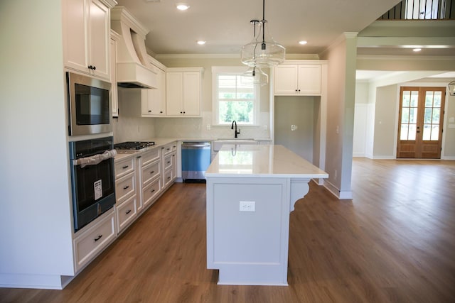 3540 Mistletoe Rd, Appling, GA 30802 - kitchen with a center island, a sink, crown molding, appliances with stainless steel finishes, and premium range hood