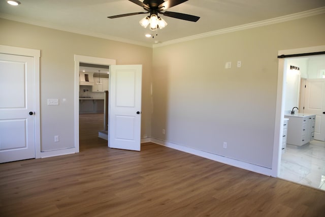 3540 Mistletoe Rd, Appling, GA 30802 - unfurnished bedroom with crown molding, baseboards, and wood finished floors