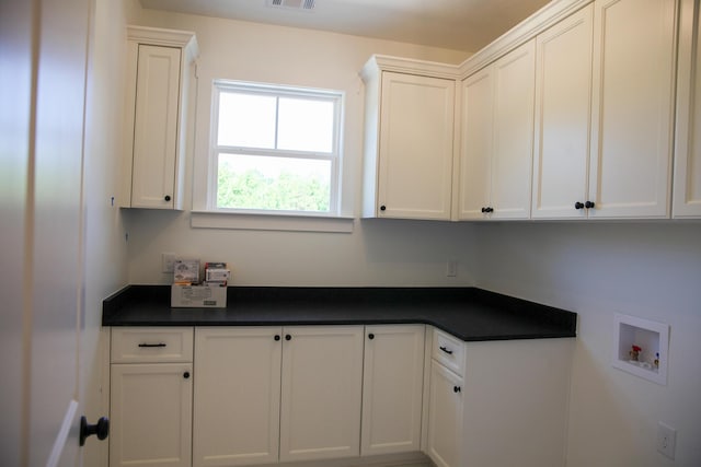 3540 Mistletoe Rd, Appling, GA 30802 - laundry room with washer hookup, visible vents, and cabinet space