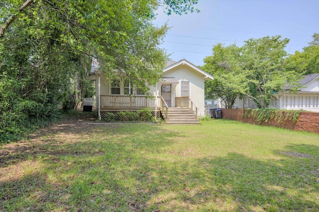 1534 Whitney St, Augusta, GA 30904 - view of front of home with a front lawn, stucco siding, and a wooden deck