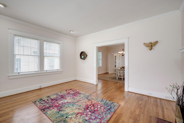 1534 Whitney St, Augusta, GA 30904 - empty room featuring a chandelier, ornamental molding, light wood-style flooring, and baseboards