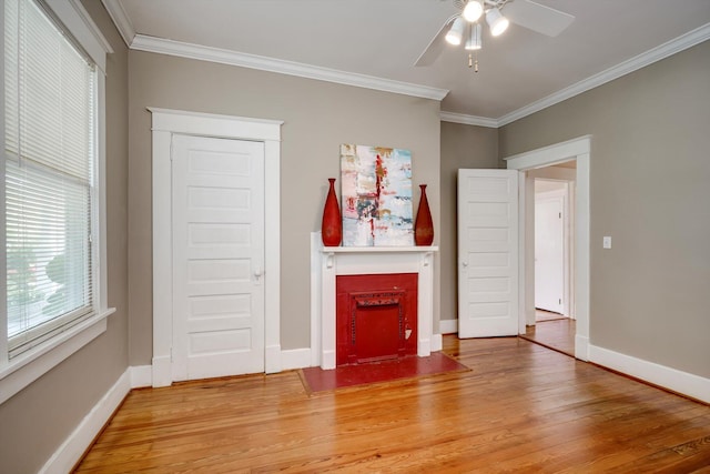 1534 Whitney St, Augusta, GA 30904 - unfurnished living room with light wood-style flooring, a ceiling fan, ornamental molding, and baseboards