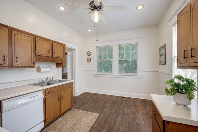 1534 Whitney St, Augusta, GA 30904 - kitchen with dishwasher, a sink, light countertops, dark wood finished floors, and brown cabinets