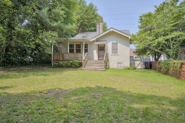 1534 Whitney St, Augusta, GA 30904 - rear view of property featuring stucco siding, a chimney, a wooden deck, and a gate