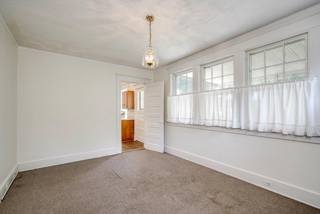 1534 Whitney St, Augusta, GA 30904 - unfurnished room with baseboards, carpet flooring, ornamental molding, and a chandelier