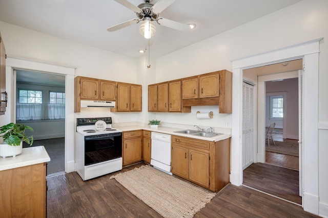 1534 Whitney St, Augusta, GA 30904 - kitchen with white appliances, ventilation hood, a sink, dark wood-style flooring, and light countertops
