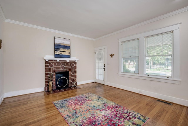 1534 Whitney St, Augusta, GA 30904 - unfurnished living room with crown molding, wood finished floors, a fireplace, and baseboards