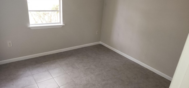 empty room with tile patterned flooring